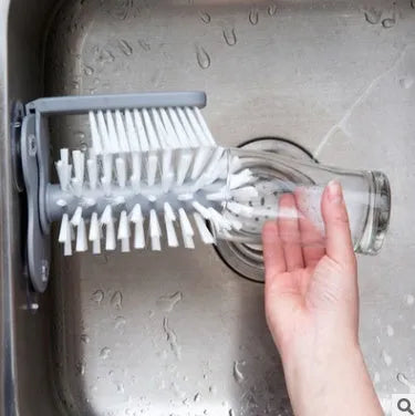Grey rotating double-headed cup brush with suction cups for wall attachment