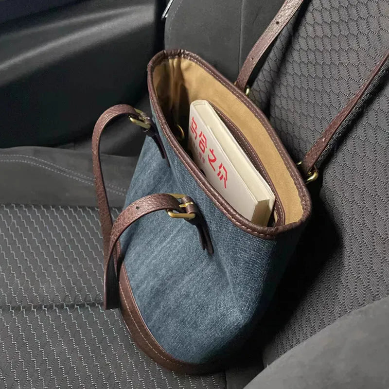 Denim patchwork one-shoulder bucket handbag showing 23x27x16cm dimensions and retro design