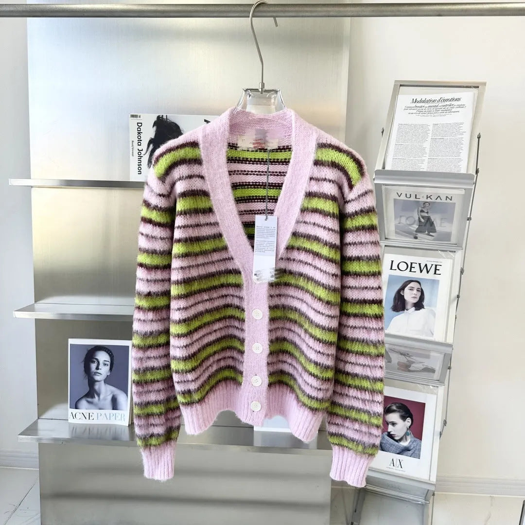 Pink wool knitted cardigan sweater with round collar on a hanger