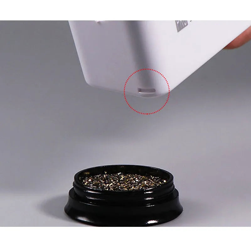 Three-layer white plastic nail powder box on a table for storing nail powder containers