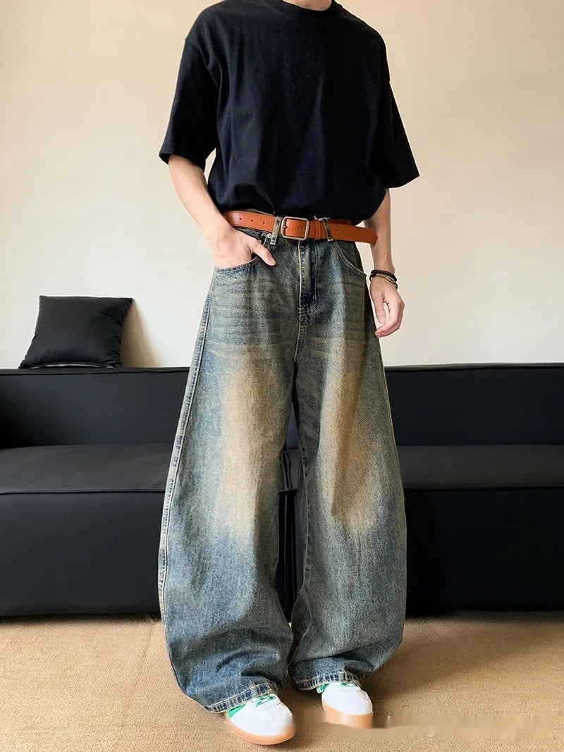 Men's retro blue distressed wide-leg jeans with micro-elastic cotton blend fabric showing distressed detailing