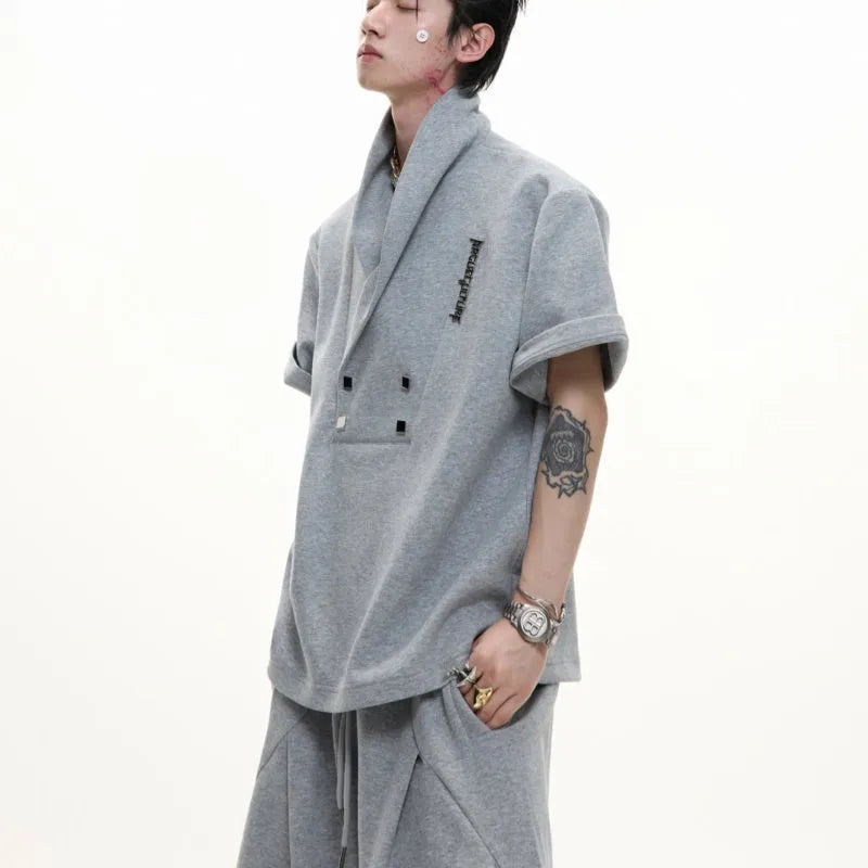 Men's dark grey V-neck cotton sports suit set with padded shoulders, metal embellishments, and matching shorts
