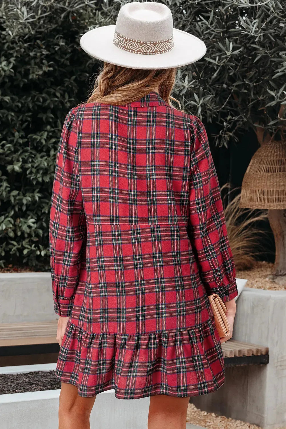 Red and black plaid women's mini dress with a shirt collar, long sleeves, and a ruffled hem.