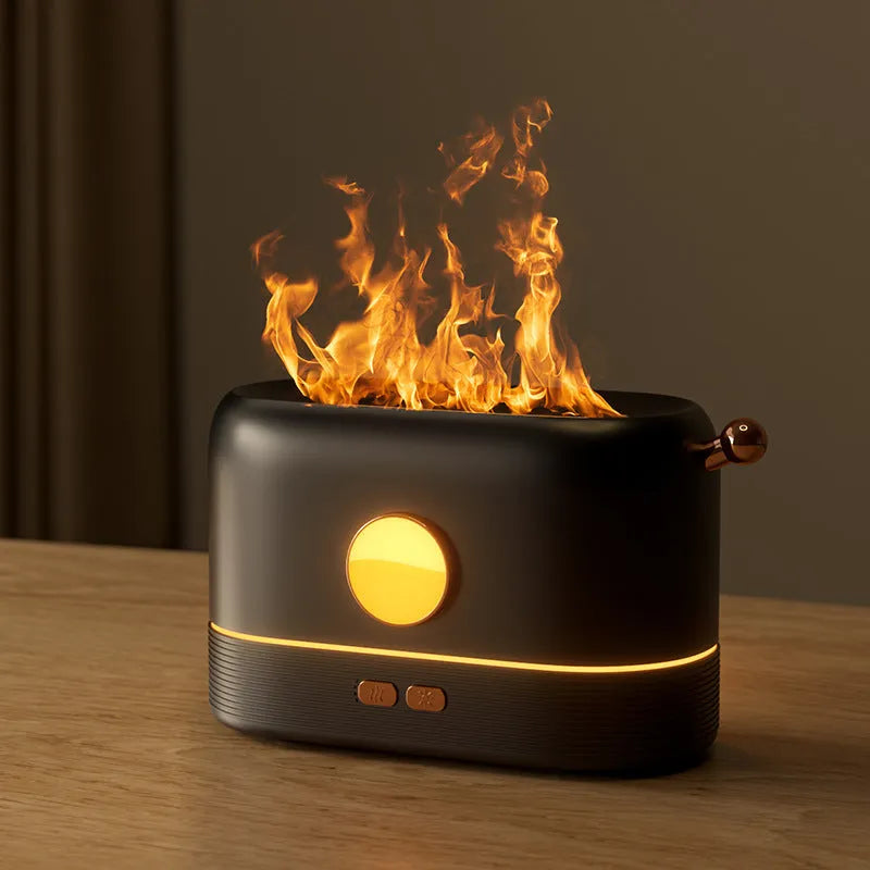 Black desktop humidifier with flame effect light and mist output, showing USB port and water tank.