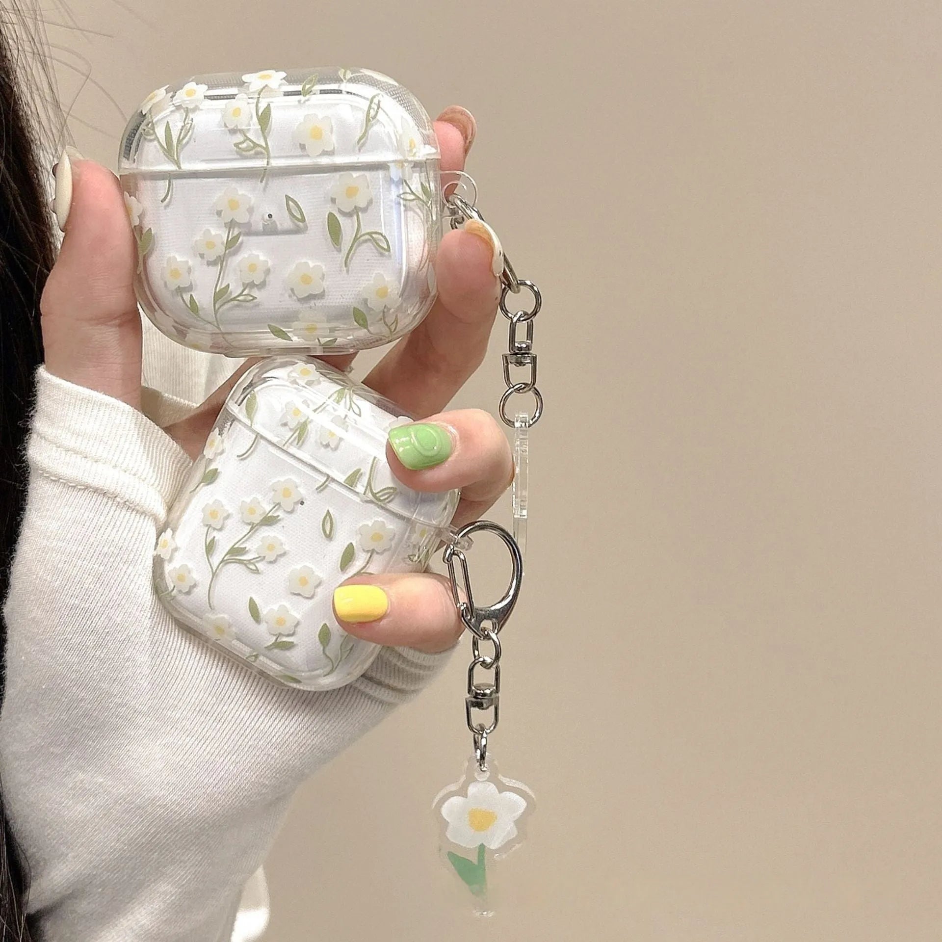 White floral high-transparent TPU protective cover for Apple AirPods on a table