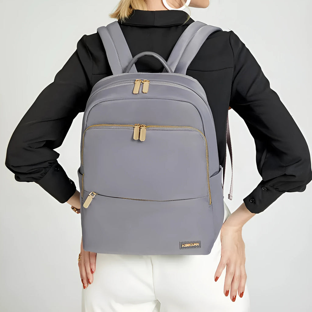 Women's Oxford cloth backpack in black or grey with large capacity and anti-theft features