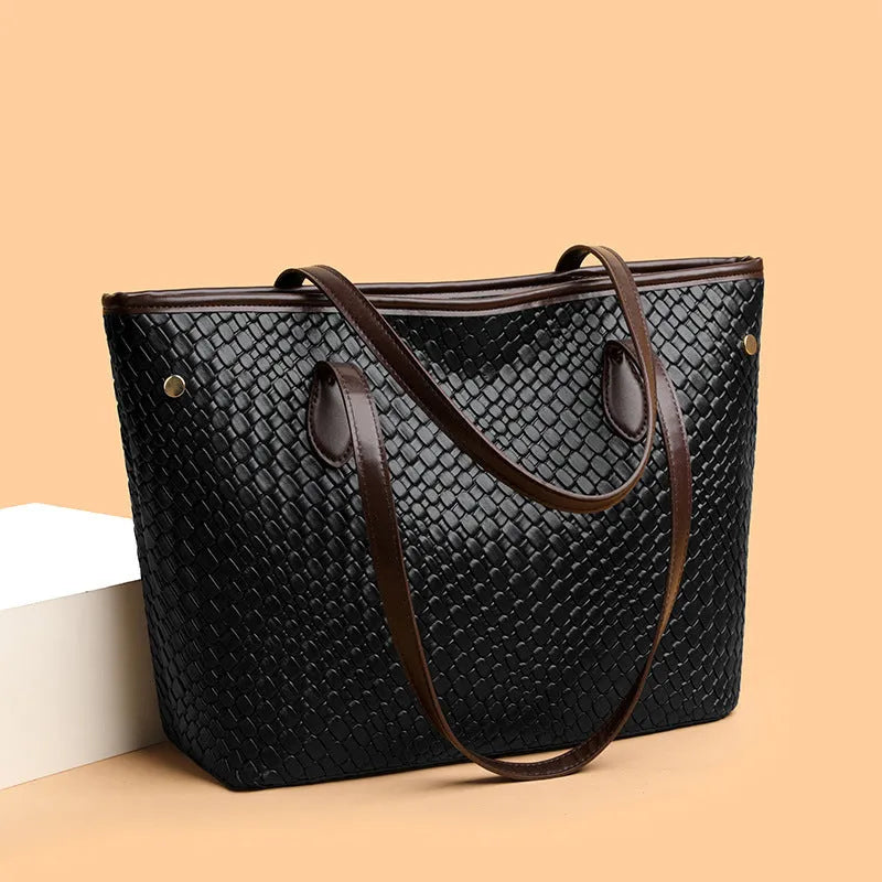 Retro women's large capacity black PU leather handbag with exterior pocket and horizontal square shape.