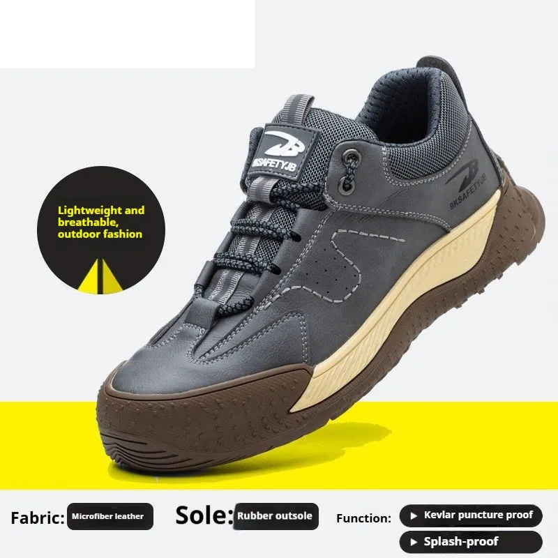 Men's black leather work safety shoes with rubber soles on a grey background