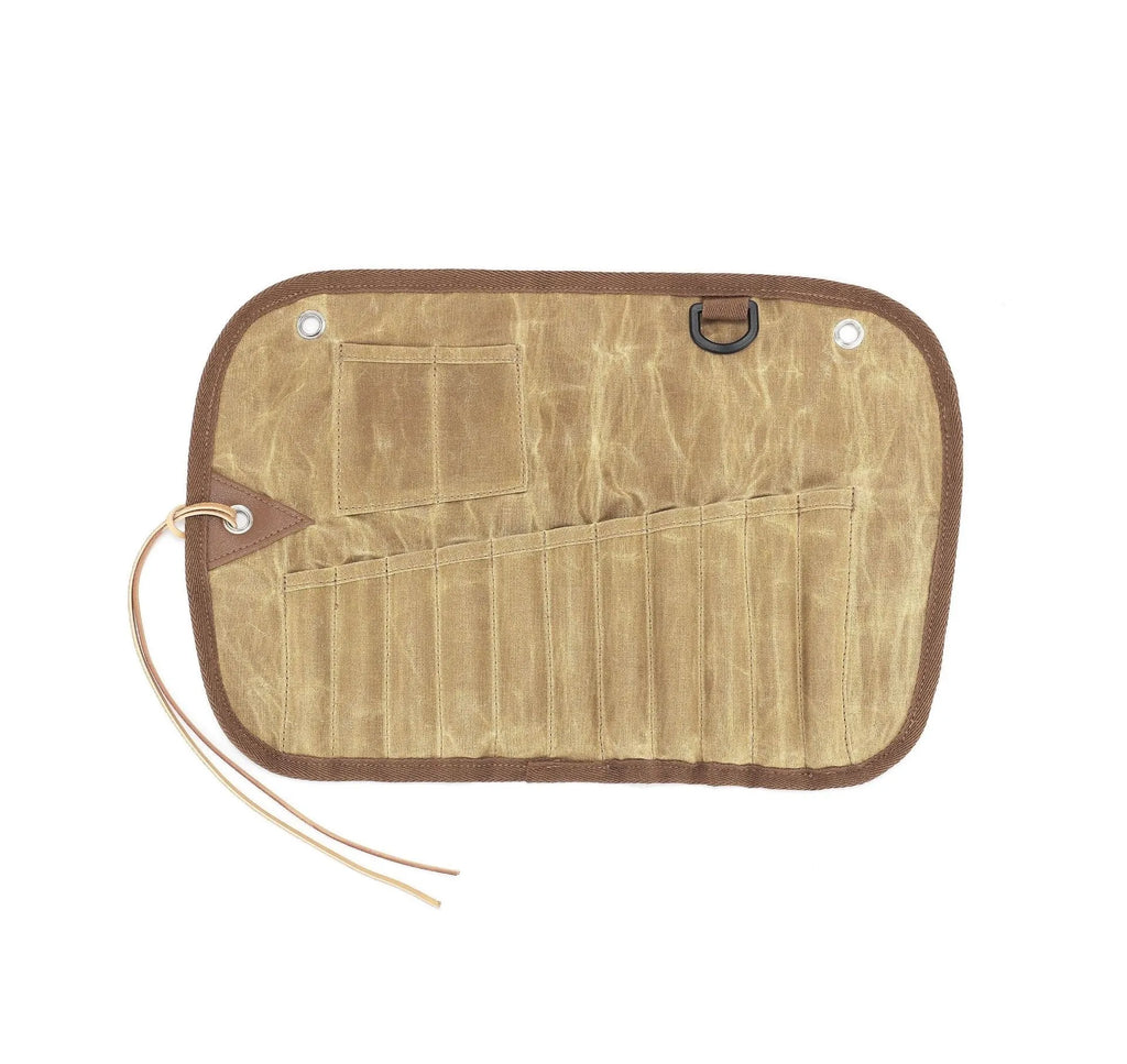Waxed canvas portable storage bag containing a wooden handle knife, fork, spoon, butter knife, coffee spoon, and chopsticks.