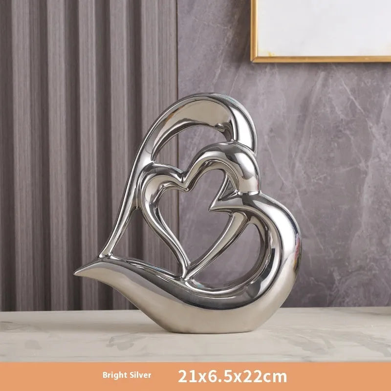 Modern white porcelain heart ornament with metallic finish in geometric design for living room or wine cabinet decoration