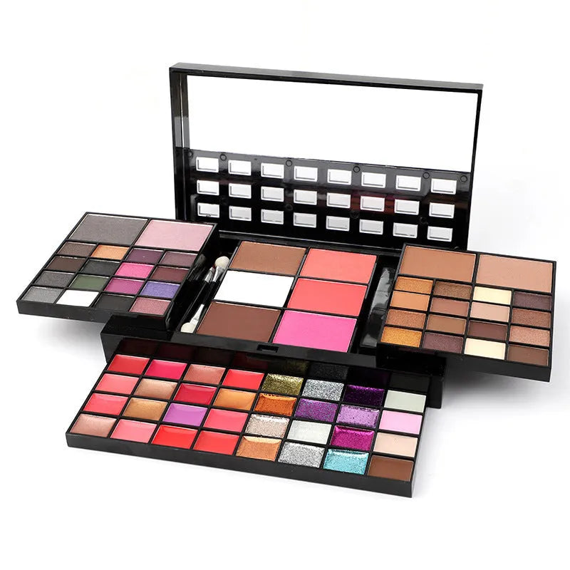 74 colour makeup palette open showing four layers of eyeshadow, lip gloss, blush and contour powders with included brushes.