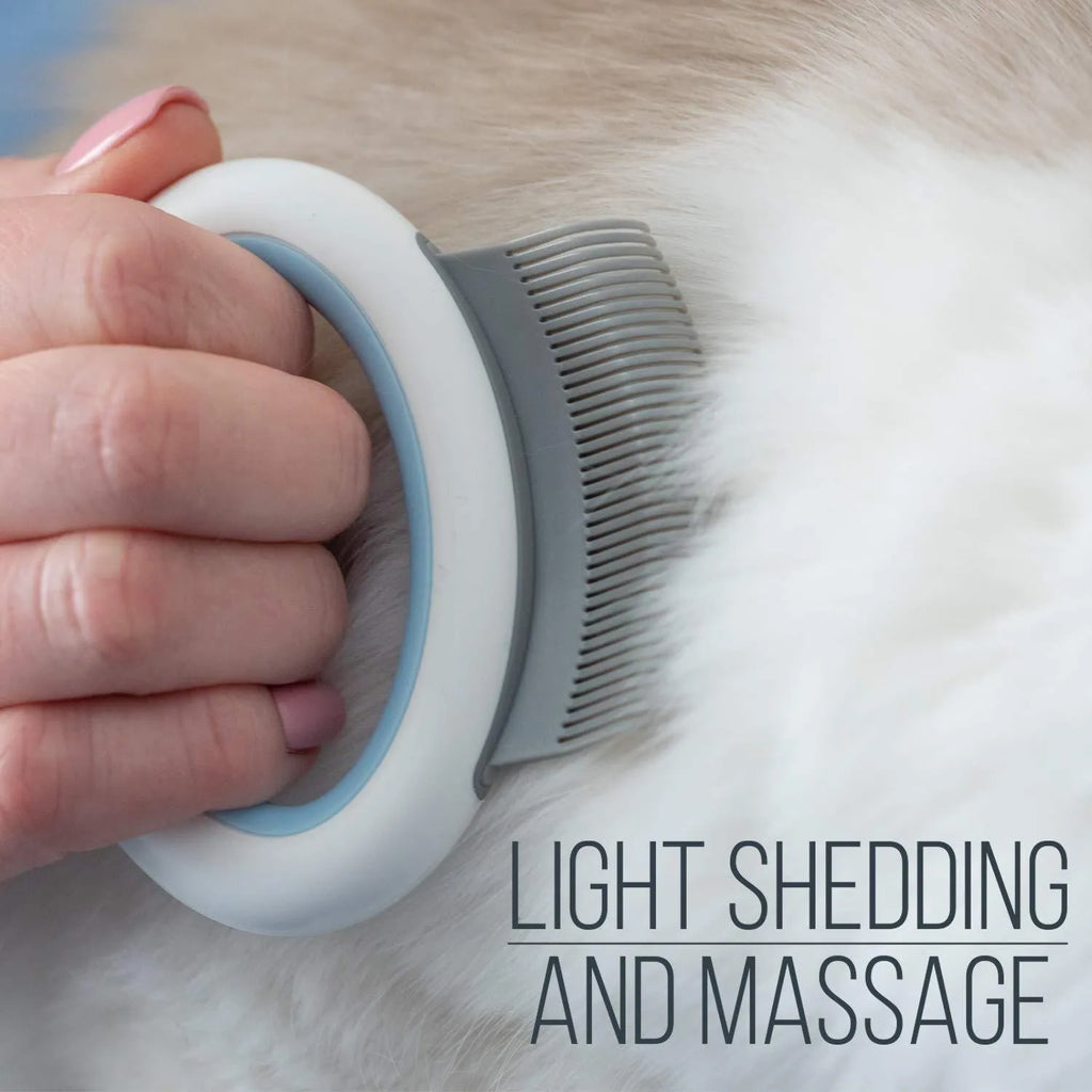Blue pet grooming comb with soft teeth for deshedding cats and dogs on white background
