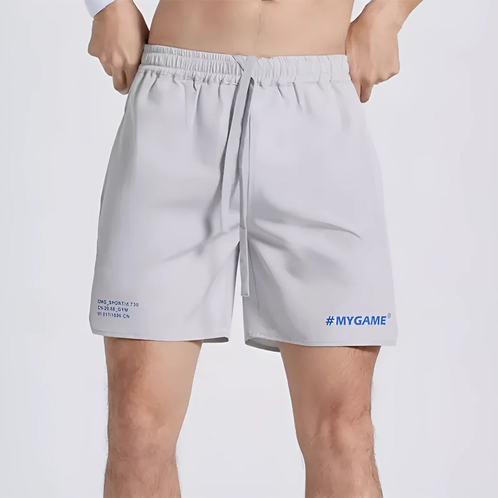 Men's navy blue training fitness shorts made from polyester spandex fabric, shown on a model.