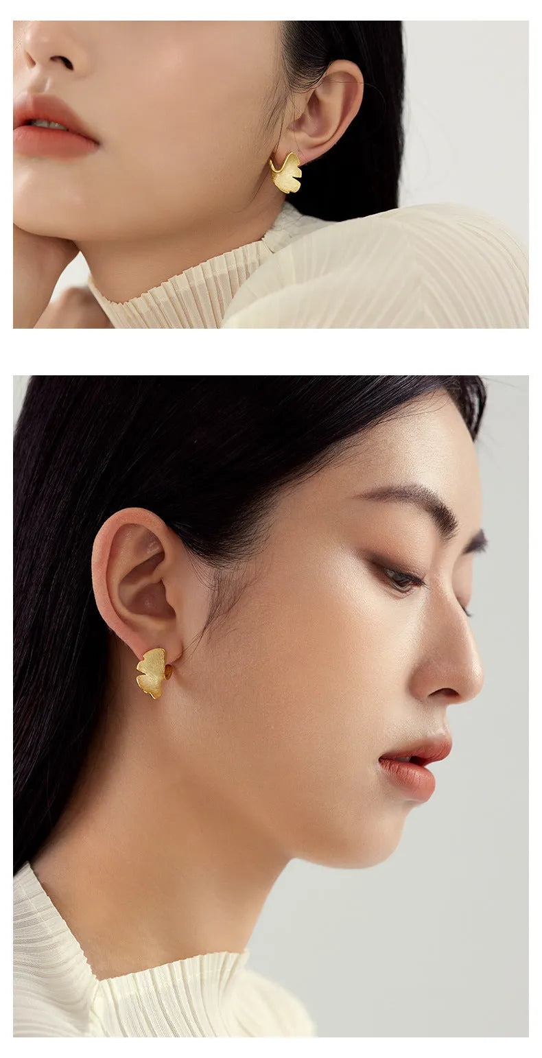 925 sterling silver stud earrings with 14k gold plated ginkgo biloba leaf design in gold colour