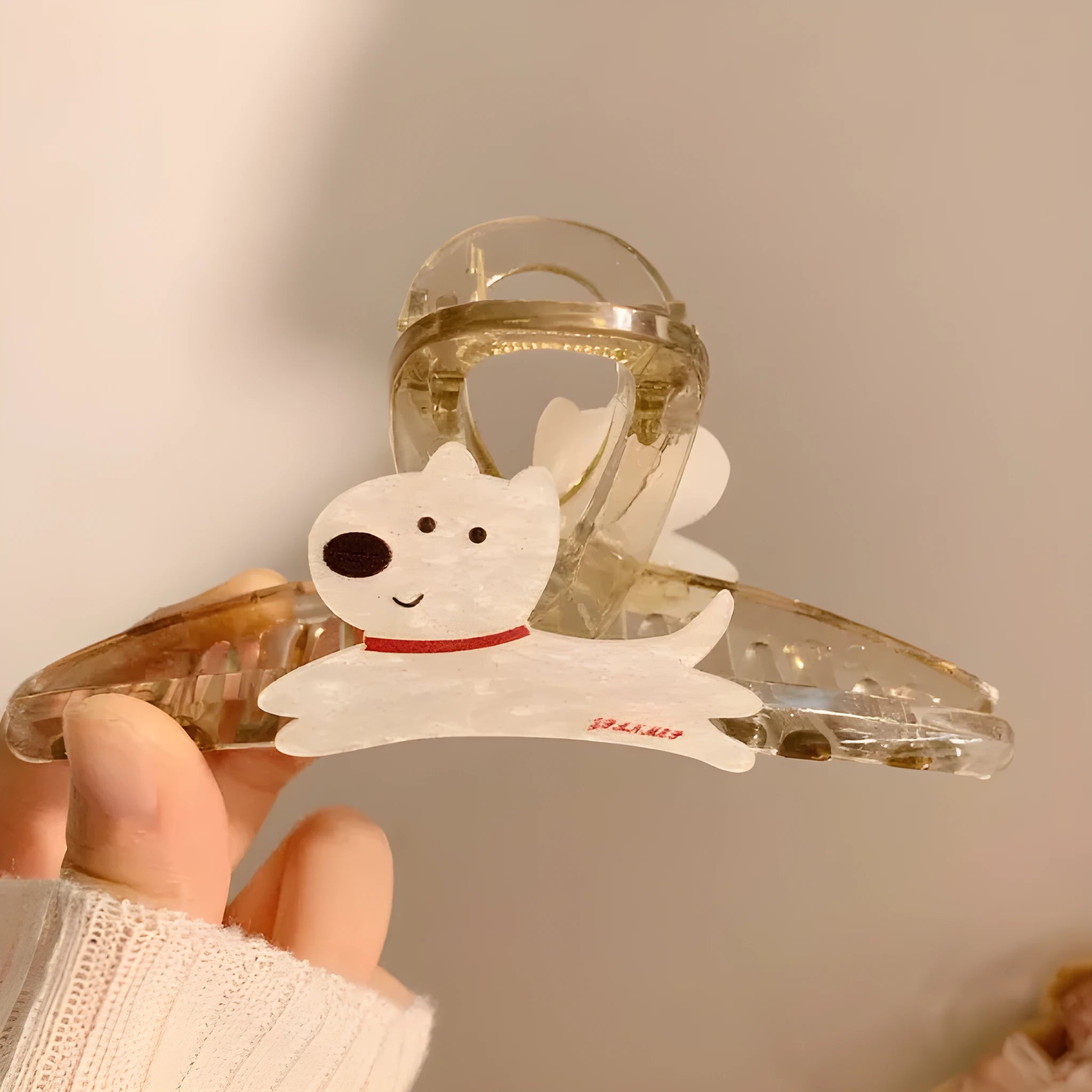 Cartoon puppy hair barrettes in beige and brown colours showing Korean style designs