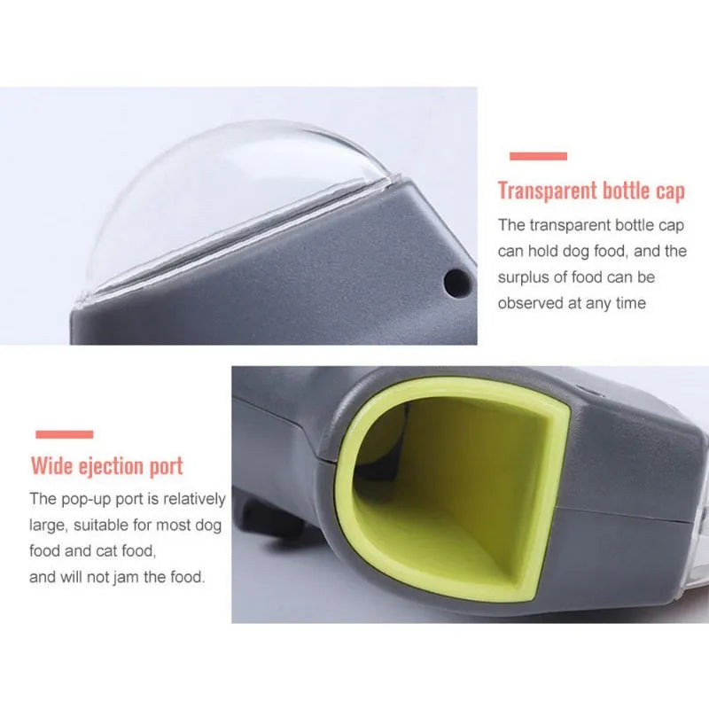 Grey compact pet snack catapult launcher on a plain background, showing the handle and trigger mechanism.