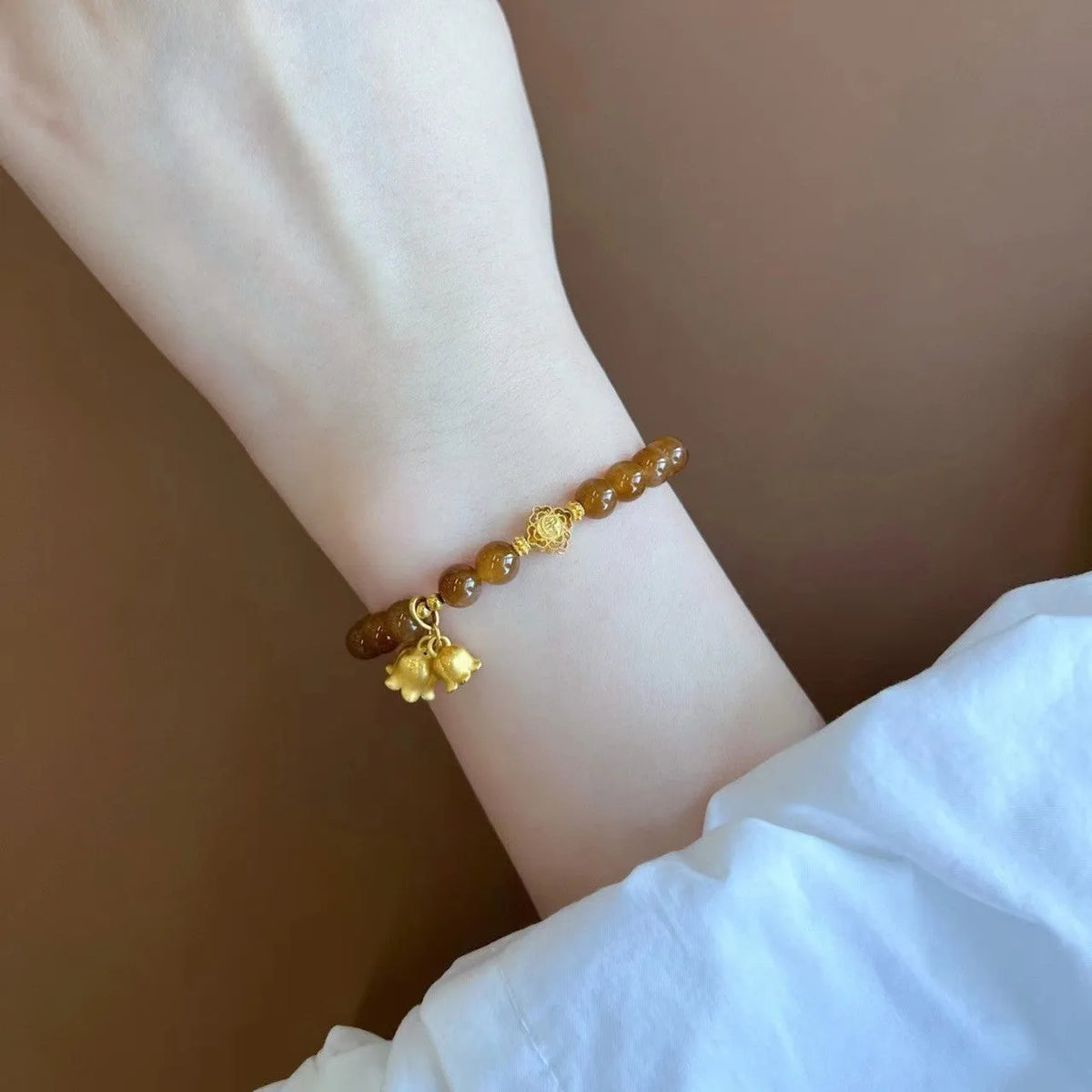 Caramel beeswax Lily bracelet with electroplated finish and floral design