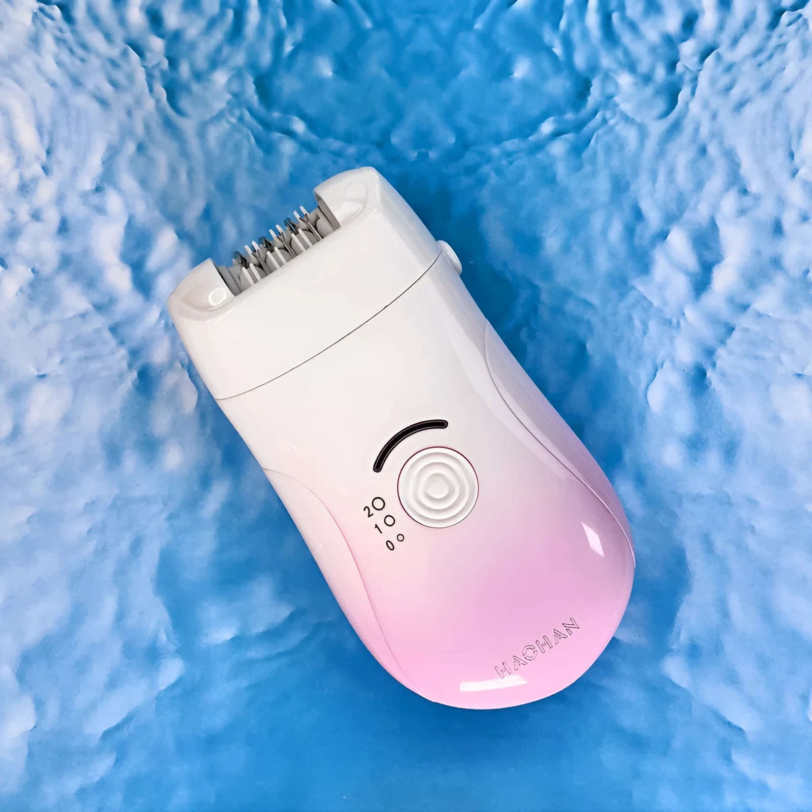 Pink three-in-one USB hair removal device with shaver head, grinding head, and skin rub accessories