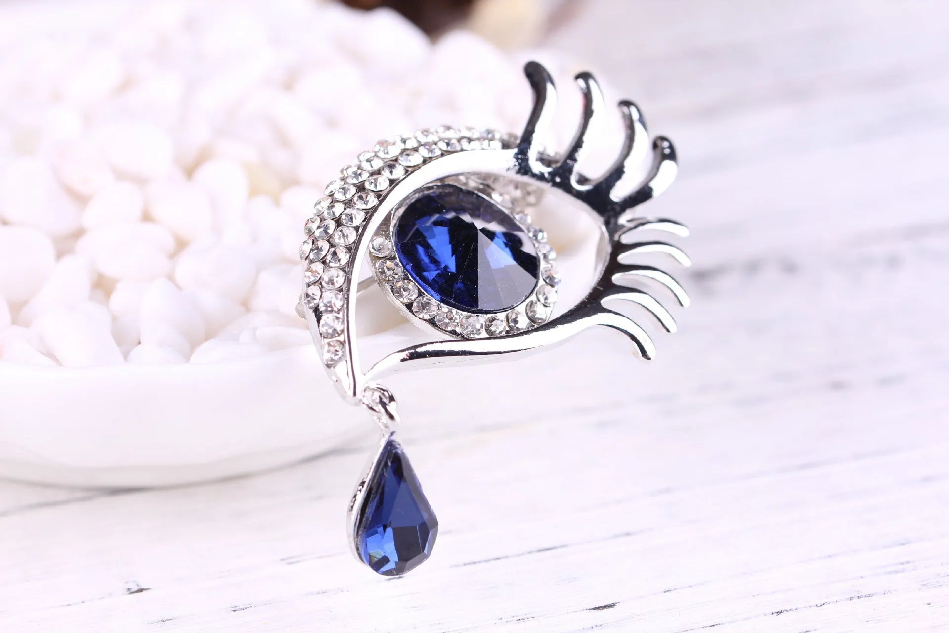 Teardrop rhinestone brooch pin alloy gold electroplated unisex totem style