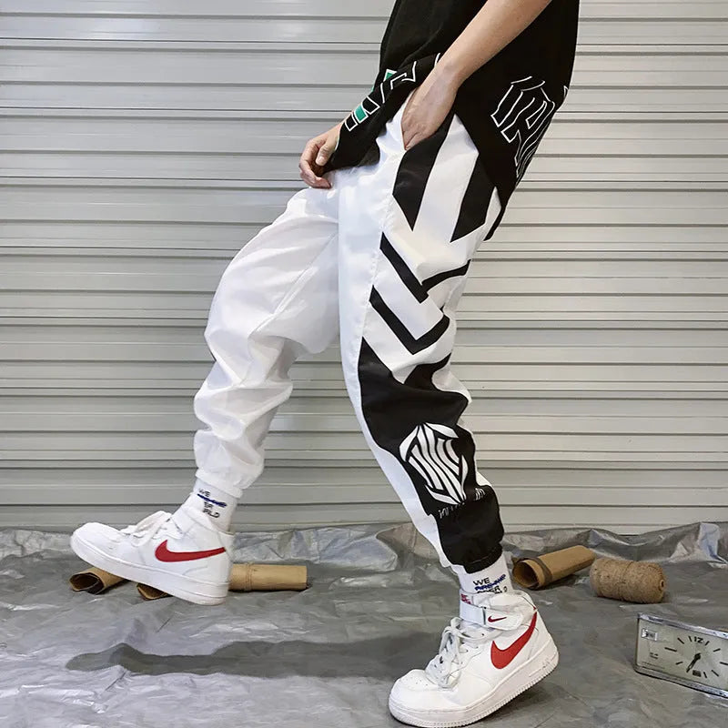 Mens hiphop tapered trousers in black acetate fibre with small-foot opening side view