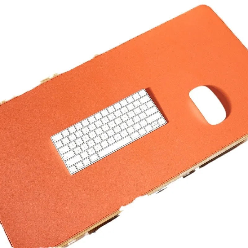 Cork leather thickened PVC mouse pad desk protector in orange on a desk showing mouse and keyboard