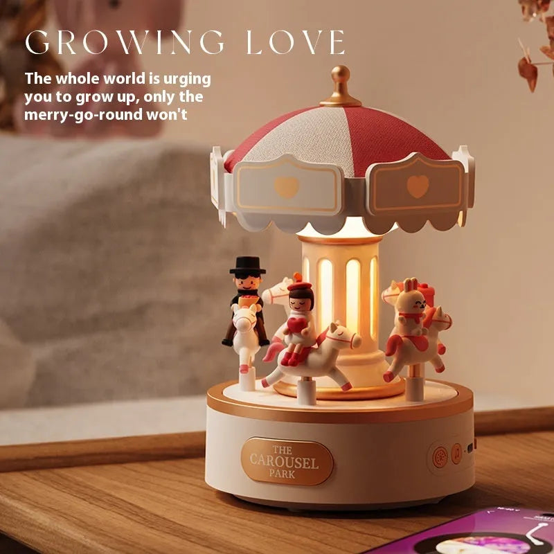 Carousel music box with ambience light showing rotating figurine and USB charging base