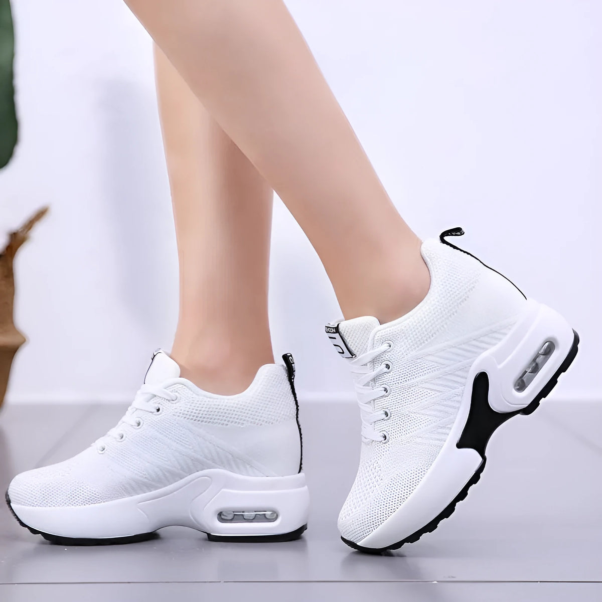 Women's lightweight casual travel shoes in white with fabric upper and round toe