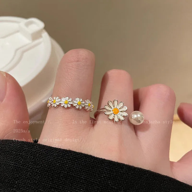 Little Daisy women's twin opening ring set in copper, one with a pearl and one plain.
