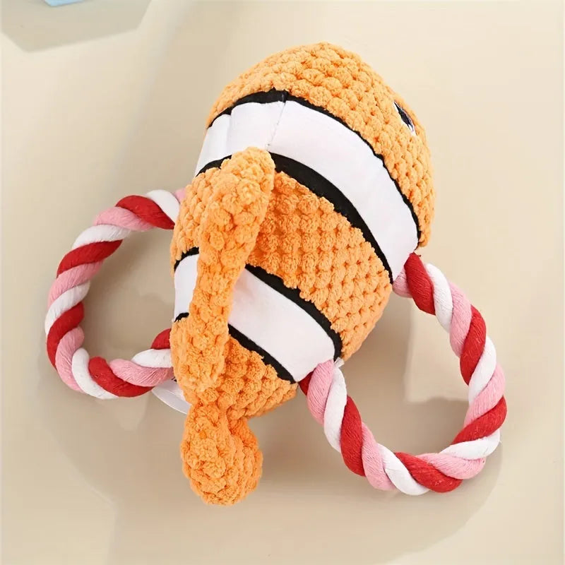 Grey turtle-shaped plush dog chew toy with knotted body and squeaker.