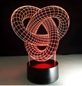 Knot 2 3D optical illusion LED lamp hologram with remote control and touch operation on a table