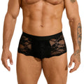 Men's black lace briefs with a hollow-out, see-through pattern laid flat.
