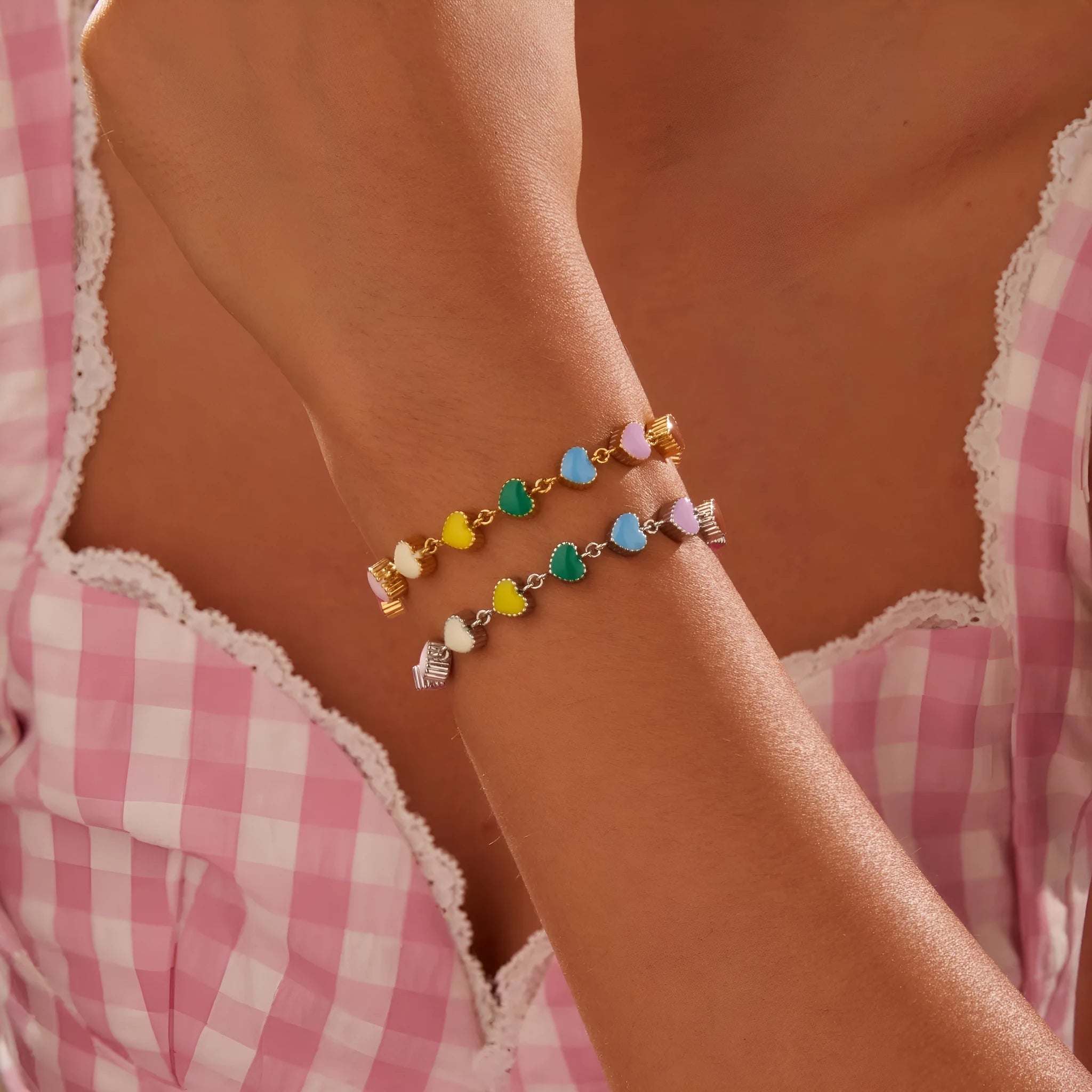 Women's titanium steel bracelet with heart-shaped charm in gold or steel electroplated finish