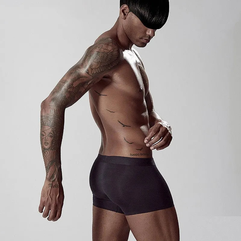 Men's seamless modal underwear in green showing mid-waist design and smooth construction