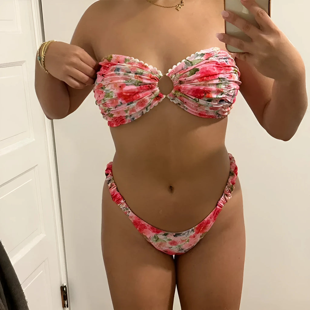Colourful floral print bikini set with tube top and briefs on a hanger.