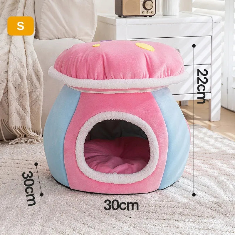 Grey mushroom-shaped plush cat bed on a wooden floor