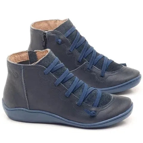Women's casual ankle booties with a wedge heel and round toe in a selection of colours including black and leopard print.