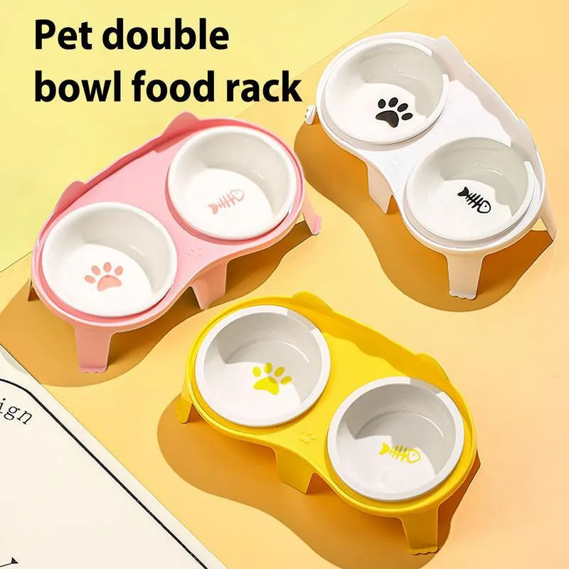 Blue ceramic cat food and water bowls on a white elevated plastic stand with a hook