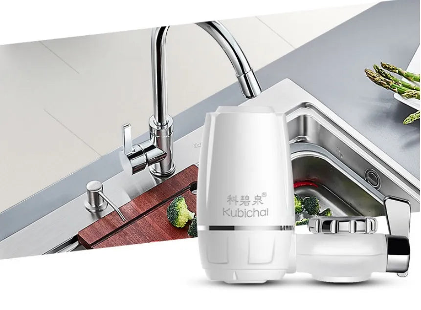 White plastic faucet water filter unit with ceramic core and universal thread adapters for kitchen tap installation.