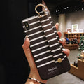 Samsung Galaxy TPU phone case with a folded-out bracket stand on a table.