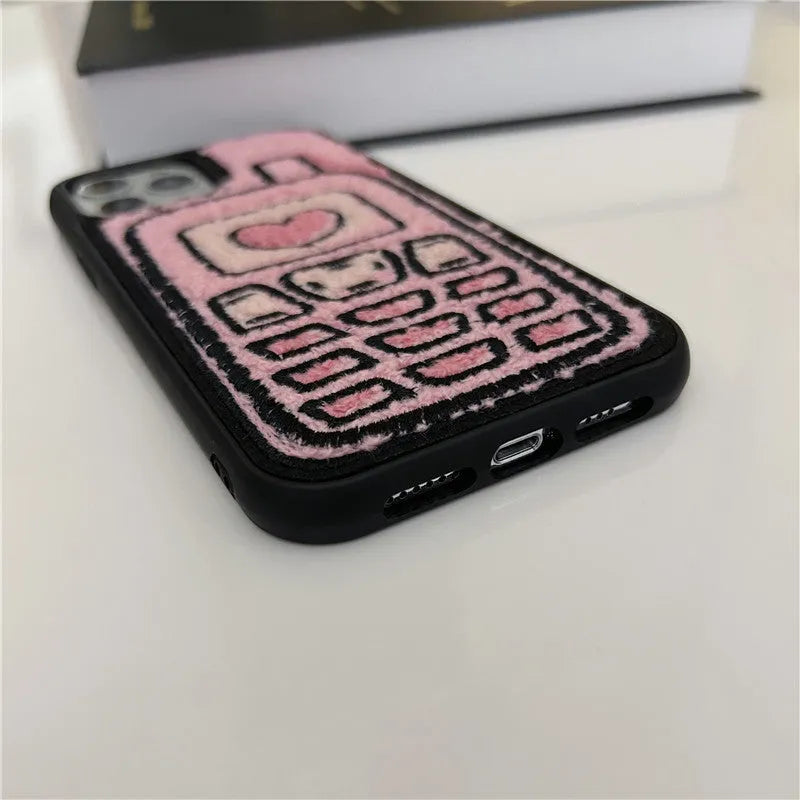 Pink TPU iPhone case with embroidered towel fabric design on back cover