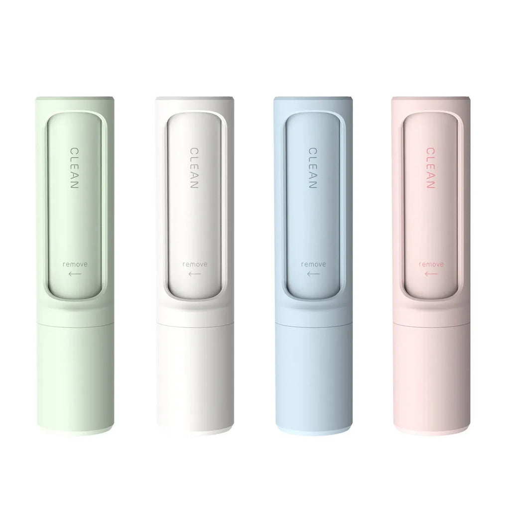 Rotating cylinder electrostatic pet hair removal brush in white, 4.3x4.3x18.3cm, on a fabric surface