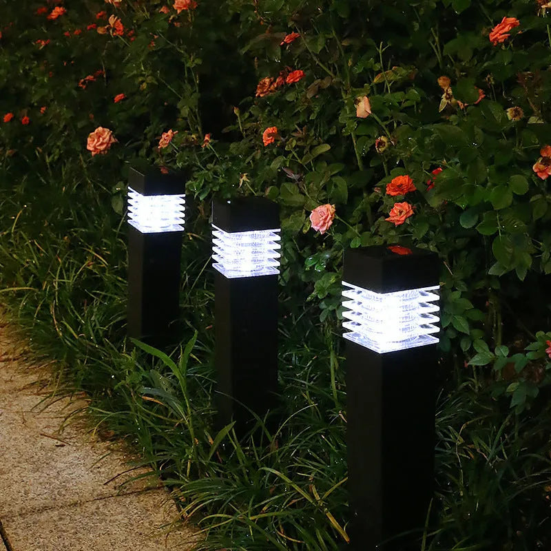 White cuboid solar-powered ground stake light for garden pathways