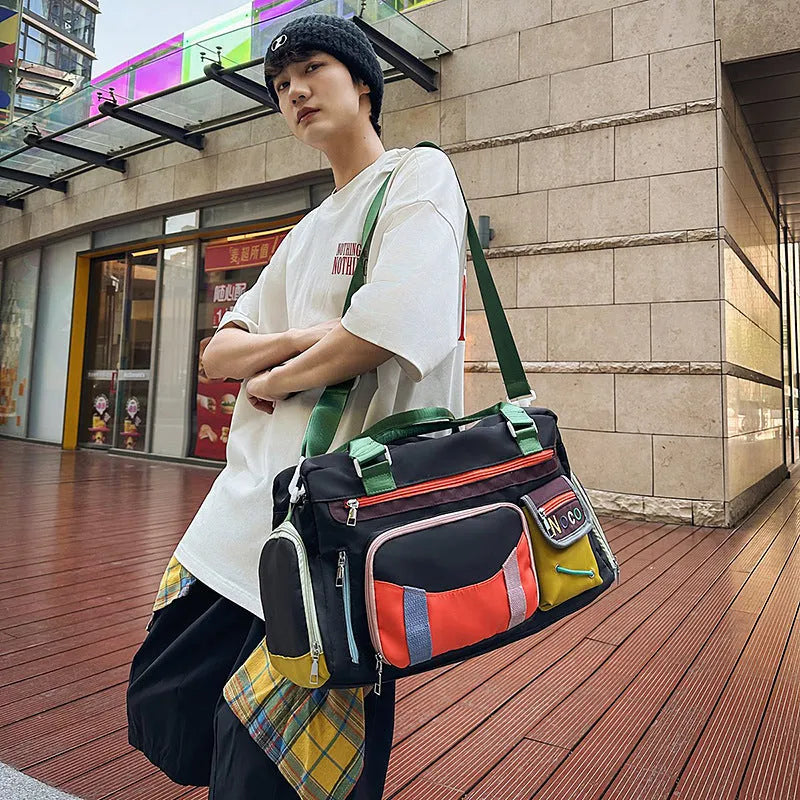 Large black oxford cloth sports messenger shoulder bag showing its spacious main compartment.