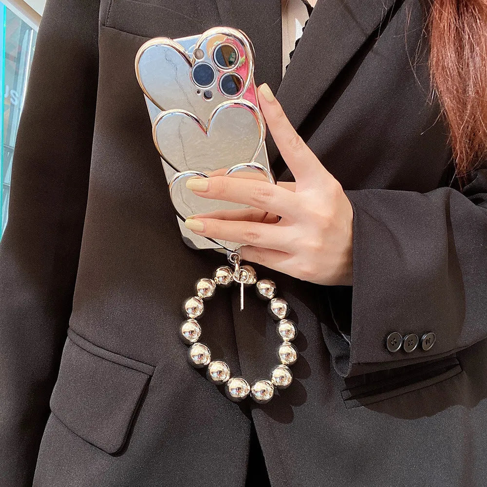 iPhone case with a 3D electroplated red love heart on a solid colour TPU soft shell.