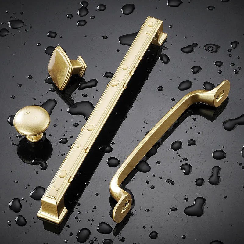 Gold single hole cabinet handle with T-shape design showing hole spacing options