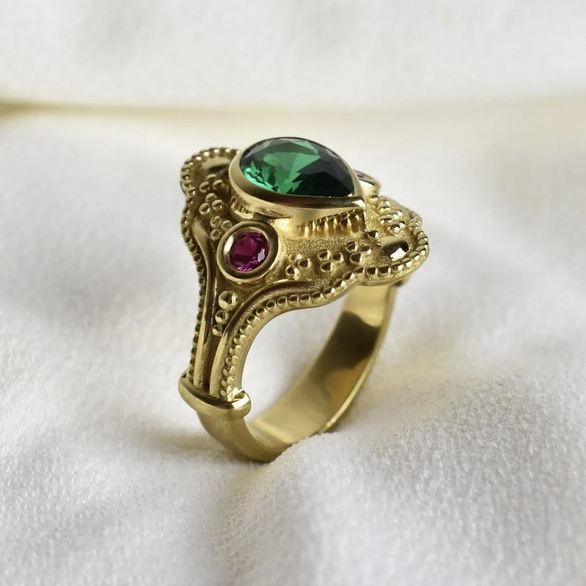 Golden geometric ins style women's alloy ring on a white background showing its electroplated finish.