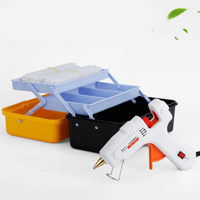 White electric hot glue gun with metal stand and safety switch.