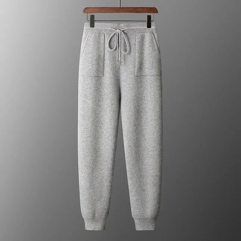 Men's light grey cashmere hooded sweatshirt and trousers set for winter leisure wear.
