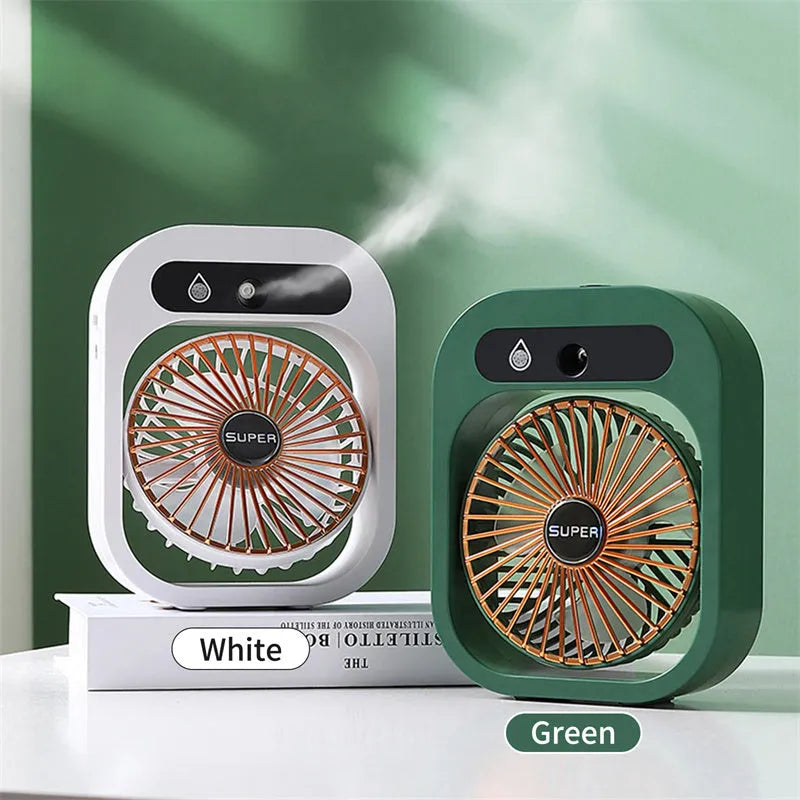 Green and white portable USB misting fan with water tank and adjustable air vent on a desk.