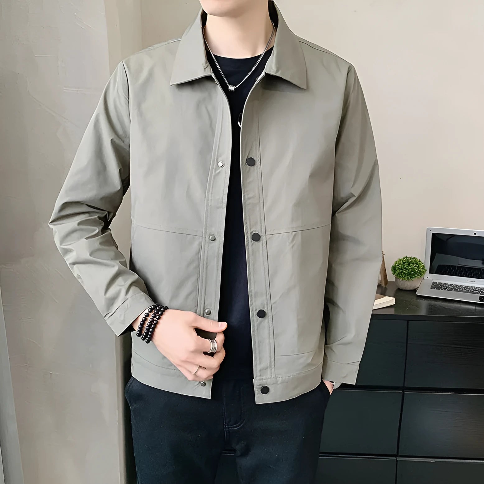 Man wearing a lightweight grey single-layer Korean-style jacket for spring or autumn.